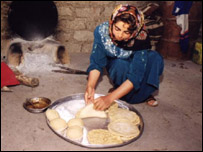 Kurdish woman prepares bread